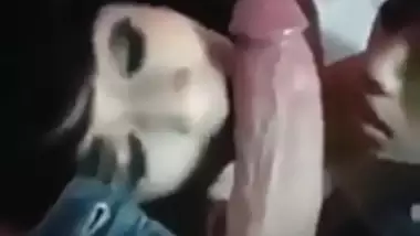 2 Indian girls sucking a big cock