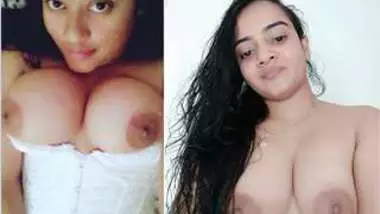 Joyful Indian girl shows how she shaves hairy pussy in the bathroom