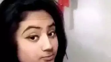 Beautiful desi girl lifting top to reveal sexy boobs