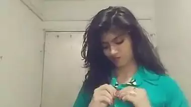 Indian teen unbuttons green shirt and takes it off just like her bra