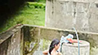 Indian Village Girl Bathing Near Water Tank Outdoor