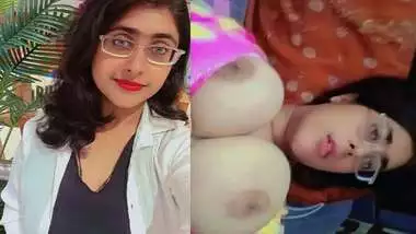 Bhabhi in glasses goes naked and fingers cunt